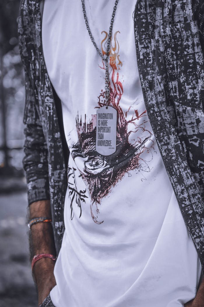 Close-up of a modern t-shirt with artistic design and inspirational quote.